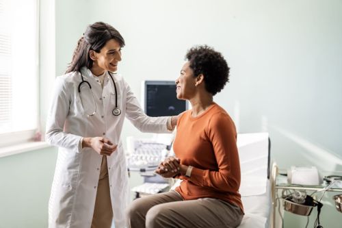 Female medical practitioner reassuring a patient - gaps in medical treatment concept
